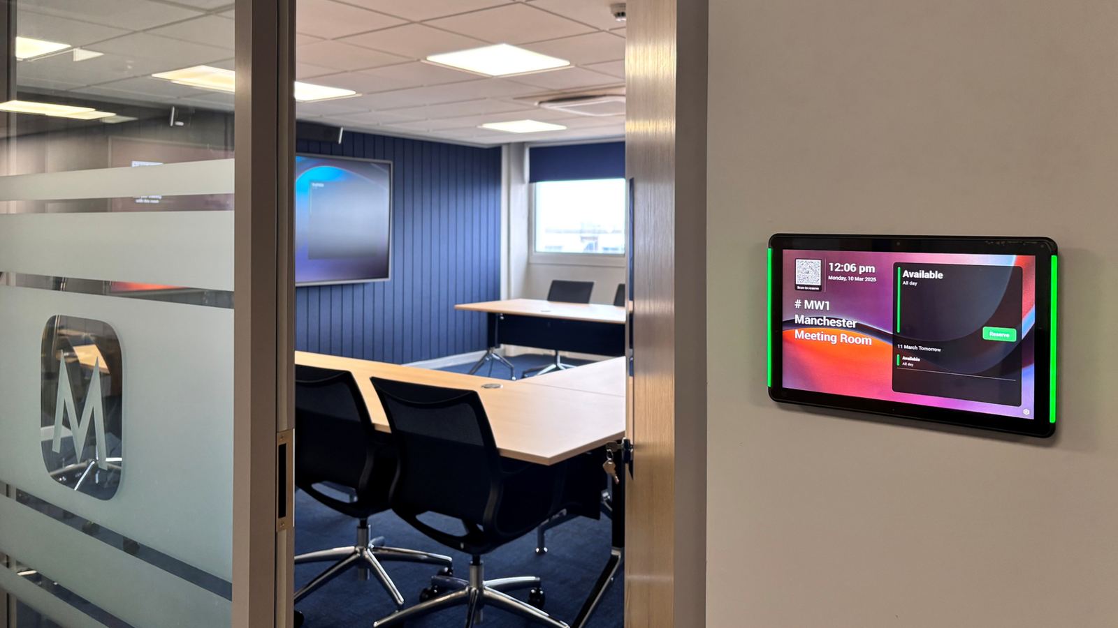 Room booking panel outside a Menzies Aviation meeting room