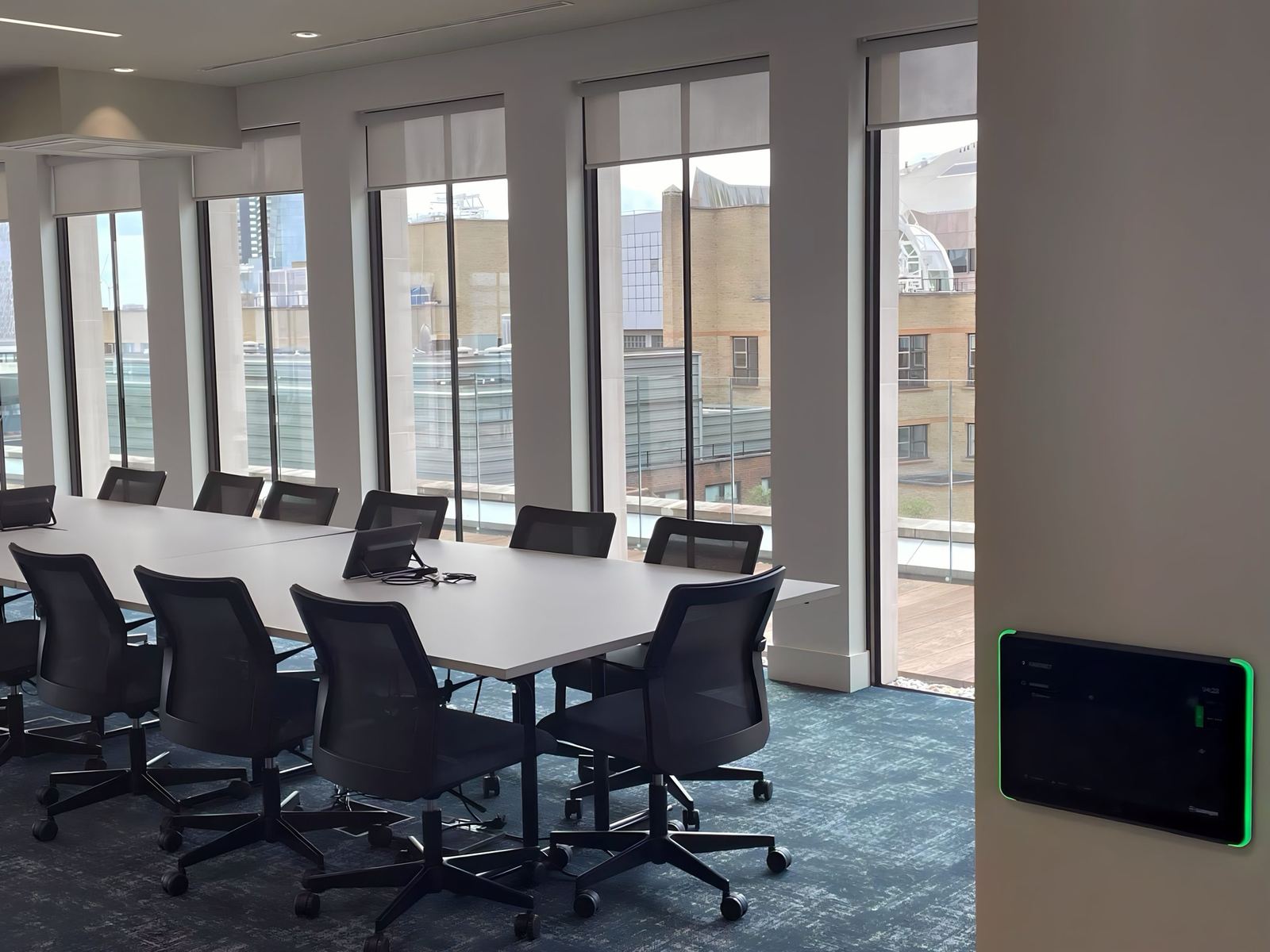 Preston Turnbull meeting room with a room booking panel by the door