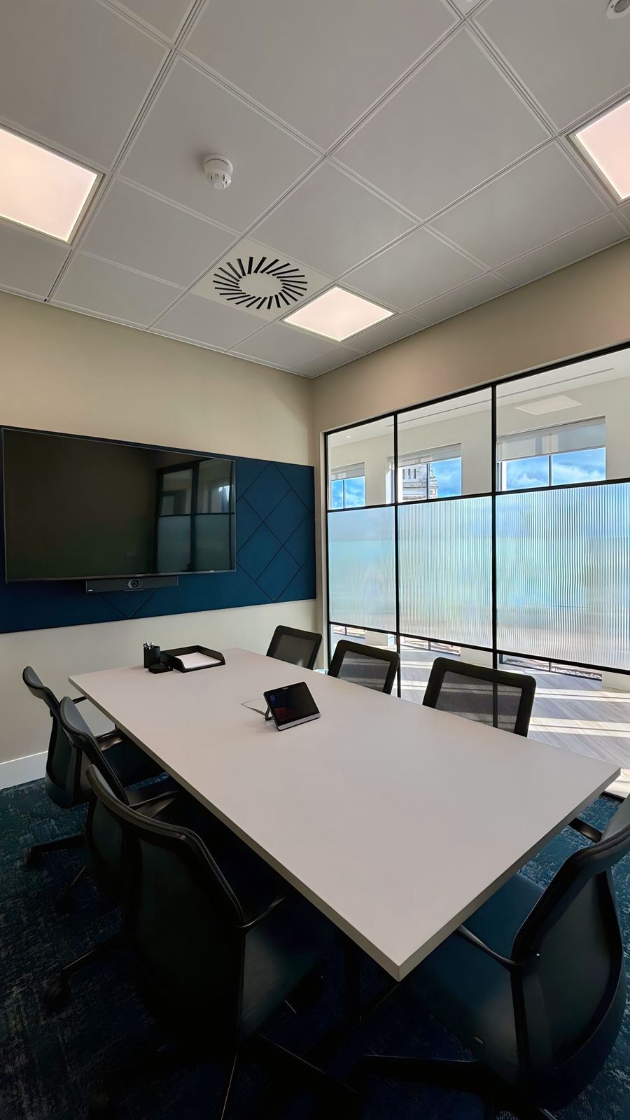Preston Turnbull meeting room table leading to a wall display