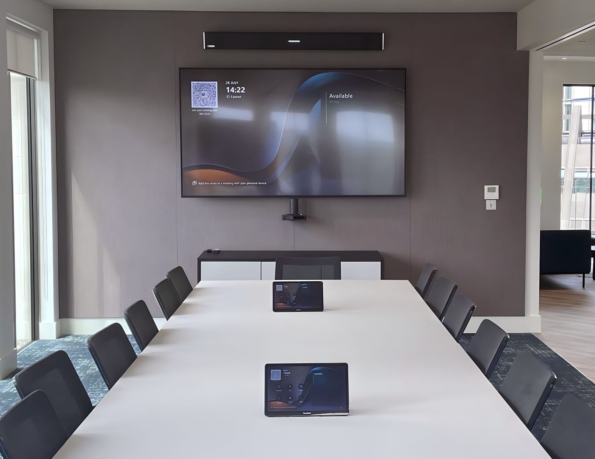 Preston Turnbull meeting room with a large display, video bar and table touch panel