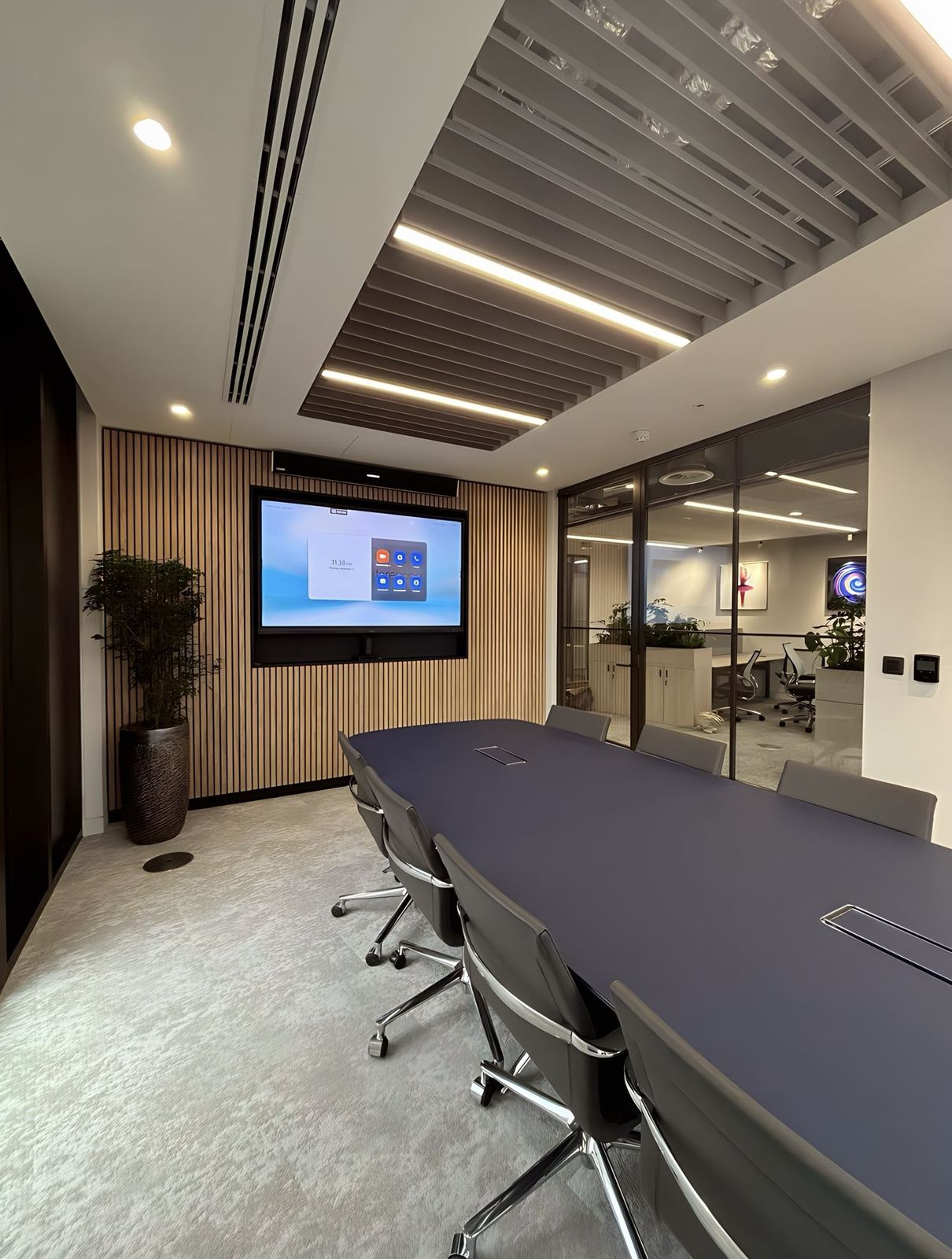 VR Capital meeting room with display, slatted ceiling and boardroom table